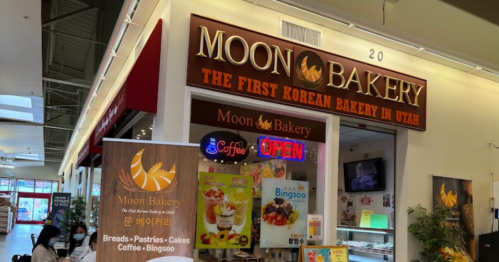 Sign for Moon Bakery, a Korean bakery in Utah, featuring "OPEN" and offerings like breads, pastries, and bingsoo.