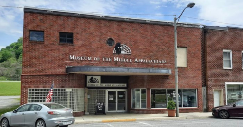 Exterior of the Museum of the Middle Appalachians, featuring a brick facade and a sign above the entrance.