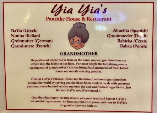 Sign for Yia Yia's Pancake House, highlighting the importance of grandmothers in cooking and family traditions.