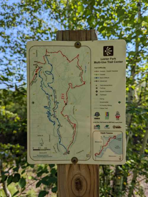 Map of Lester Park Multi-Use Trail Center showing trails in red and blue, with difficulty levels and features indicated.