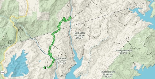 Map showing a hiking trail in a mountainous area, with elevation markers for nearby peaks and water features.