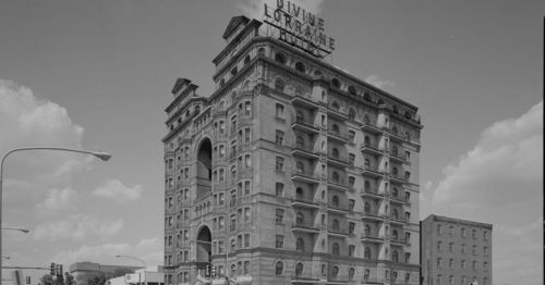 Historic black-and-white photo of the Lorraine Hotel, featuring its distinctive architecture and signage.