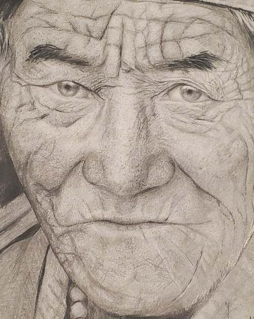 Close-up of an elderly person's face, showcasing deep wrinkles and expressive eyes, conveying a sense of wisdom and experience.