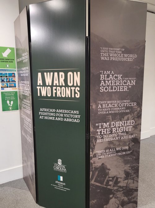 Exhibit display featuring quotes about African American soldiers and their struggles during wartime and at home.