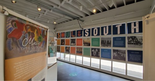 Exhibit titled "Soul of the South" featuring colorful panels and text about music's cultural significance.