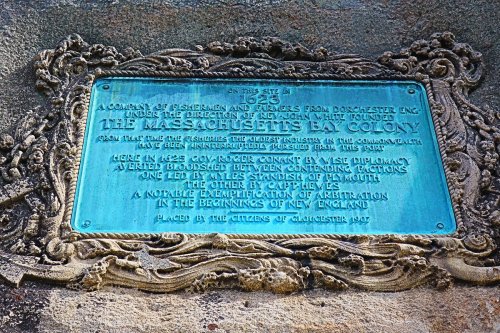 Plaque commemorating the Massachusetts Bay Colony, detailing its founding and significance in Gloucester, 1927.