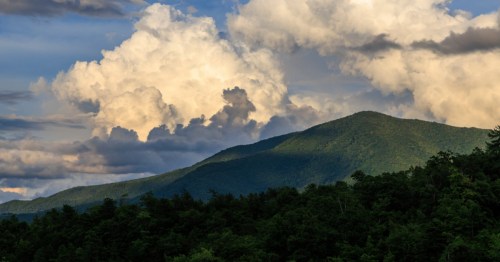 view of the mountains under large white clouds in wears valley tennessee