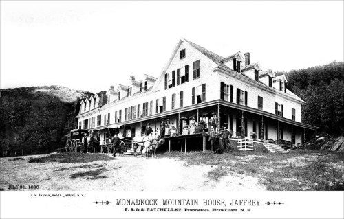 Historic black-and-white photo of Monadnock Mountain House, with people and horse-drawn carriages in front.