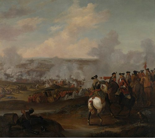 A historical battle scene with soldiers on horseback, cannons, and smoke in the background, depicting chaos and conflict.