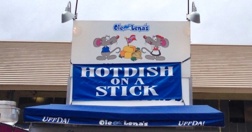 Sign for Ole Lena's featuring cartoon mice and the phrase "Hotdish on a Stick" in bold letters.