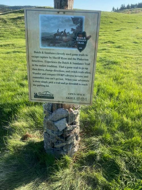 Sign for the Butch & Sundance Trail, detailing its history and directions for exploring the area.