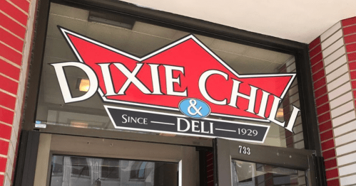 Sign for Dixie Chili & Deli, established in 1929, featuring a red crown logo and bold lettering.