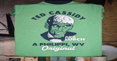 Green t-shirt featuring a graphic of Ted Cassidy as Lurch, with text "A Philippi, WV Original" below.