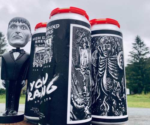 A spooky figure stands beside cans of beer featuring dark, artistic designs, set against a cloudy sky and trees.