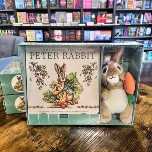 A boxed set featuring "The Tale of Peter Rabbit" book and a plush rabbit toy with a carrot.