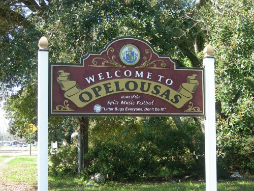 Welcome sign for Opelousas, home of the Spice Music Festival, with a message about littering.