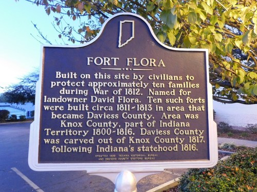 Historical marker for Fort Flora, detailing its significance during the War of 1812 and the establishment of Daviess County.