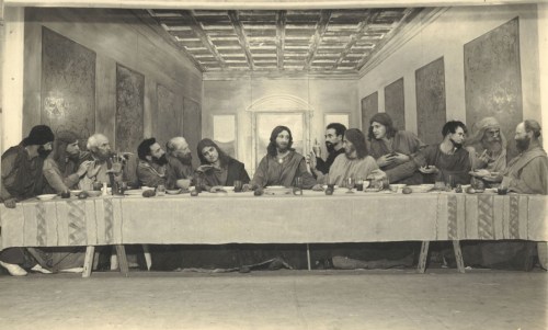 A black-and-white depiction of the Last Supper, featuring Jesus and his disciples at a long table.