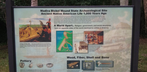 Sign at Madira Bickel Mound State Archaeological Site detailing ancient Native American life and cultural structures.