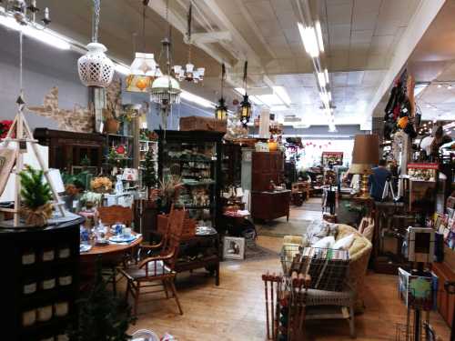 A cozy antique shop filled with vintage furniture, decor, and various collectibles, creating a warm, inviting atmosphere.