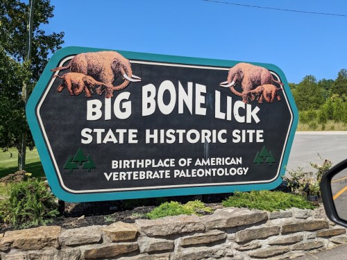 Sign for Big Bone Lick State Historic Site, highlighting its significance in American vertebrate paleontology.