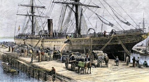 A historic ship docked at a port, with workers and horses unloading cargo on a wooden pier.