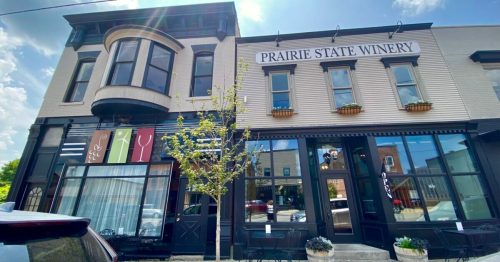 Exterior view of Prairie State Winery, featuring a stylish building with large windows and decorative elements.