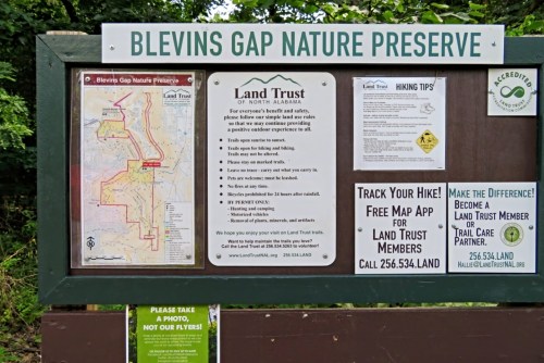 Signboard at Blevins Gap Nature Preserve with a map, hiking tips, and contact information for the Land Trust of North Alabama.