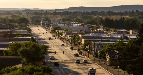 Summer sunrise views of the main street of Cody, Wyoming.