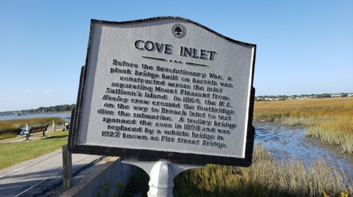 Historical marker about Cove Inlet, detailing its bridge history and significance near Sullivan's Island.