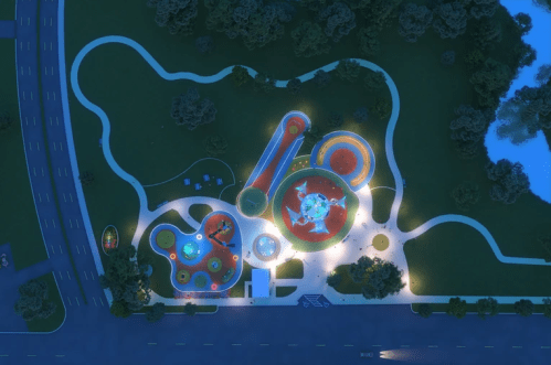 Aerial view of a brightly lit playground at night, featuring colorful play structures and surrounding green spaces.