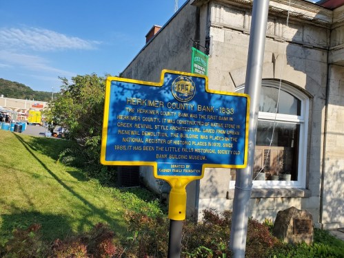 Historical marker for Herkimer County Bank, established in 1833, highlighting its architectural significance and museum status.