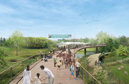 A vibrant zoo entrance with families walking on a wooden path, surrounded by greenery and a clear blue sky.