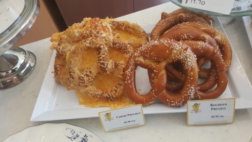 A platter of cheese pretzels and Bavarian pretzels, with price tags displayed beside each type.
