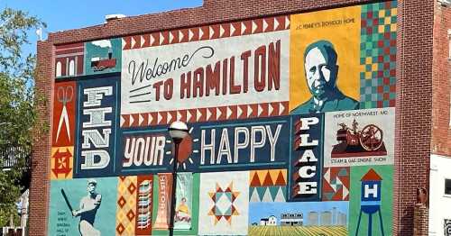 Colorful mural in Hamilton, featuring the text "Welcome to Hamilton" and "Find Your Happy Place" with various designs.