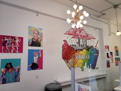 Colorful ice cream shop interior featuring vibrant artwork and a sign that reads "Remixx."