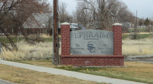 Sign for Ephraim, Utah, noting it as "Little Denmark" and home of the Scandinavian Festival and Snow College Badgers.