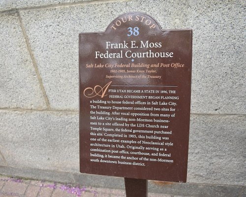 Sign for Frank E. Moss Federal Courthouse, detailing its history and significance in Salt Lake City.