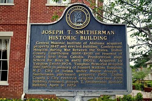 Sign for the Joseph T. Smitherman Historic Building, detailing its historical significance and various uses over the years.