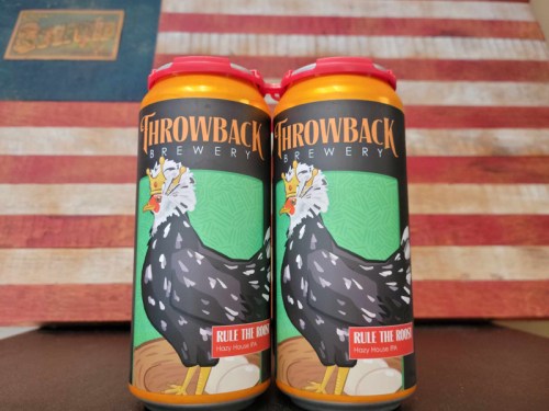 Two cans of "Rile the Roost" Hazy IPA from Throwback Brewery, featuring a cartoon chicken design, against a vintage flag backdrop.