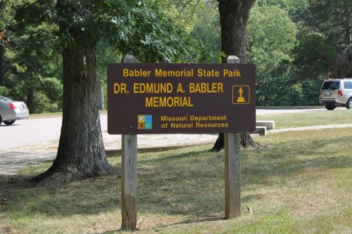 Sign for Babler Memorial State Park, featuring "Dr. Edmund A. Babler Memorial" and Missouri Department of Natural Resources.