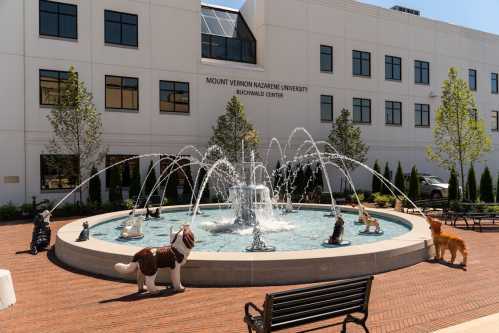 A fountain with water jets surrounded by animal sculptures in front of Mount Vernon Nazarene University's Buchwald Center.