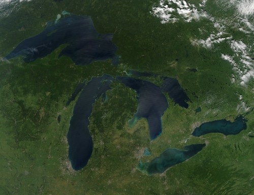 Aerial view of the Great Lakes region, showcasing lakes and surrounding green land.