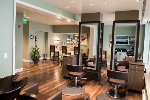 Modern salon interior with styling chairs, mirrors, and a welcoming atmosphere.