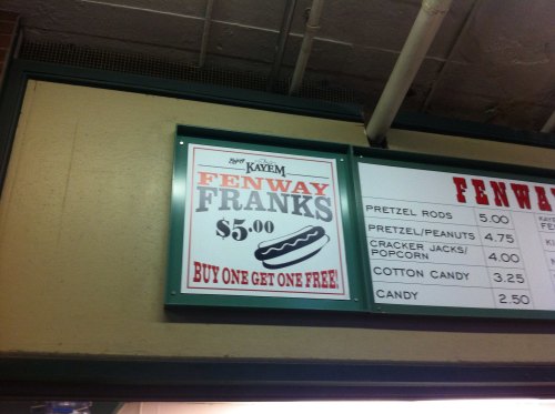 Sign advertising "Fenway Franks" for $5, with a "Buy One Get One Free" offer.