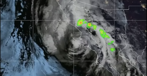 Satellite image of a storm system near the Baja California coast, showing swirling clouds and rainfall.