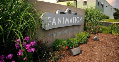 Sign for Fanimation at 10983 Bennett Parkway, surrounded by greenery and flowers.