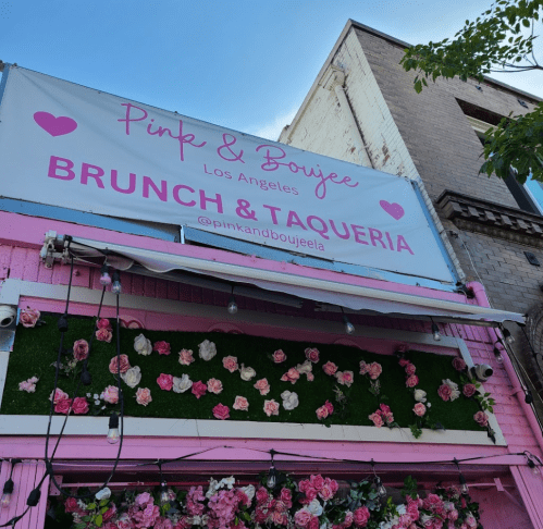 Sign for "Pink & Boujee" in Los Angeles, featuring pink and floral decor, advertising brunch and taqueria.