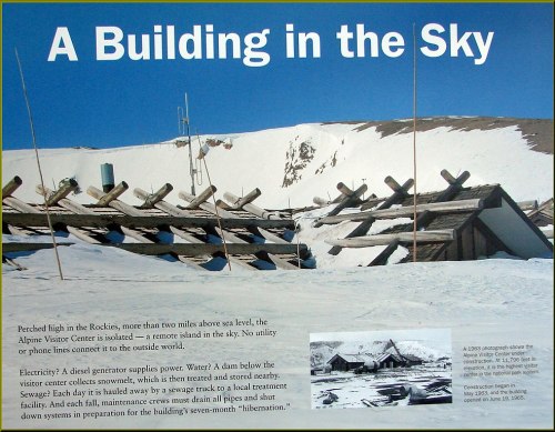 Image of a snowy mountain landscape with a building and wooden structures, accompanied by informational text about the site.