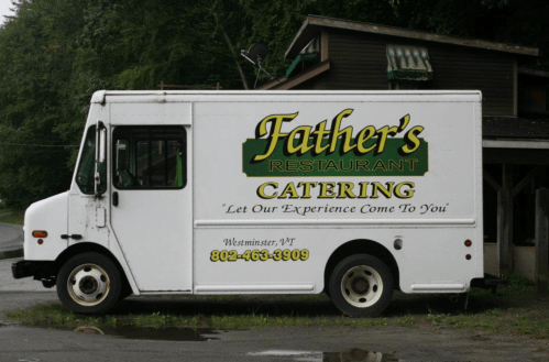 A white catering truck with "Father's Restaurant" and contact information parked on a street in Westminster, VT.